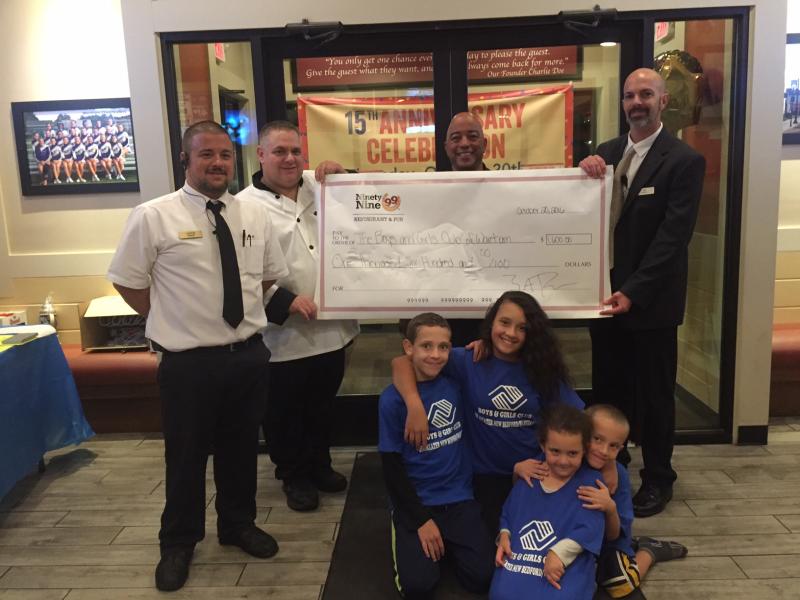 From left: Aaron Correia, Kevin Pratt, Kenny Fontes, director, Boys & Girls Club of Greater New Bedford/Wareham, Zolton Phillips, General Managing Partner, Wareham Ninety Nine Restaurant & Pub and members from the Boys & Girls Club of Greater New Bedford/Wareham with the donation. COURTESY NINETY NINE RESTAURANT
